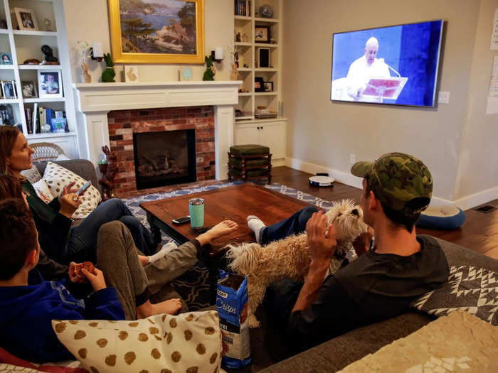 Although nobody but the pope and a single assistant was physically present at the service, millions watched on TV around the world. The image below shows the McClenahan family in Washington state watching the address.