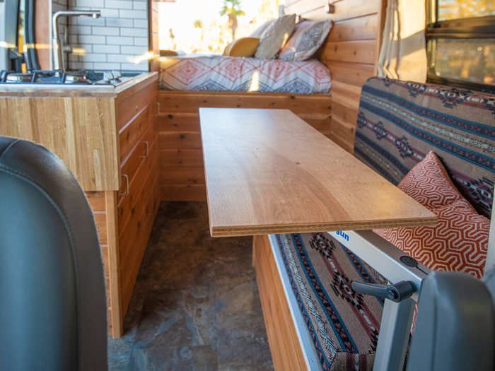 The swivel table serves as a dining table. It can also be tucked away into the garage when it