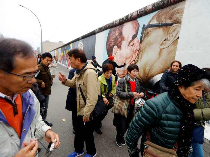 BEFORE: Another major tourist attraction and historical site, the East Side Gallery —seen here in November 2017 — is always packed with tourists.