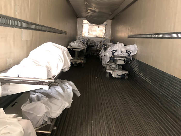 As the rate of COVID-19 patients outstrips hospital resources, more and more bodies are going to morgues. The city has requested emergency mortuary assistance from FEMA, but hospitals have already begun to expand capacity. At least one hospital is using a 53-foot refrigerated semi-trailer to temporarily hold overflow.