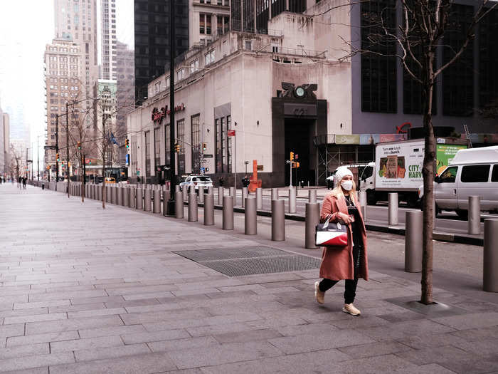 Photos of New York City streets show people largely adhering to the social distancing guidelines. All nonessential businesses, public schools, and tourist attractions have been shuttered, leaving the streets unusually quiet.