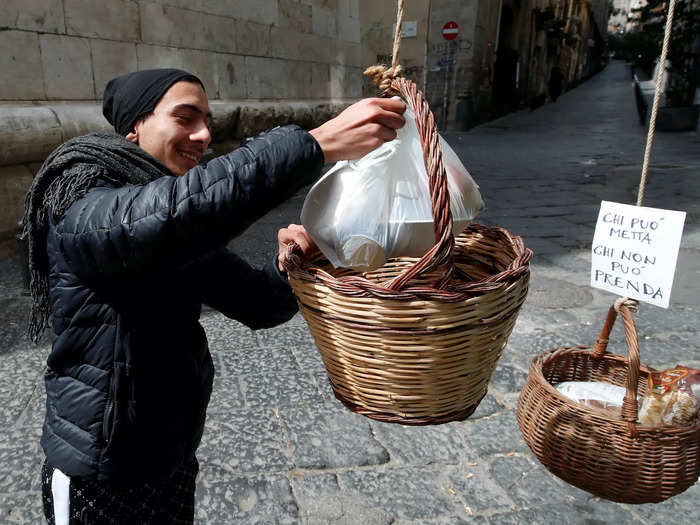 To help one another, people across Italy have been filling baskets with food and leaving them in the streets for neighbors to pick up what they need.