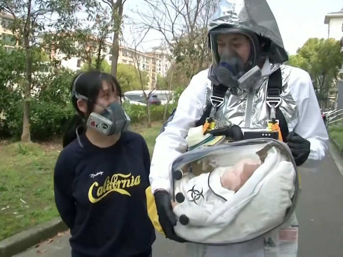 The pod attaches to a full-body suit so that Cao and his wife Fang Lulu can take their child outside on walks.