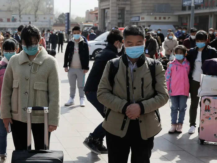 The suitcases, pictured here in Beijing, suggest that people are resuming travel within the country after weeks of being sealed off from one another. These citizens also stopped to observe the moment of silence.