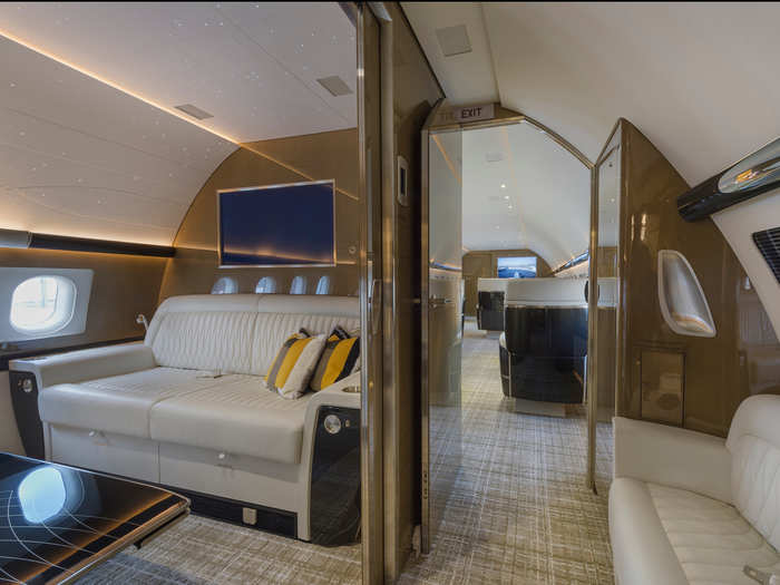 The space also features a high-definition in-flight entertainment screen perfect for relaxing on a long flight. Opposite the lounge is also a smaller two-person divan for extra guests.