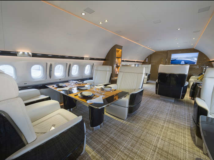 Directly behind is the lounge is the dining area complete with two large tables on each side of the aircraft.