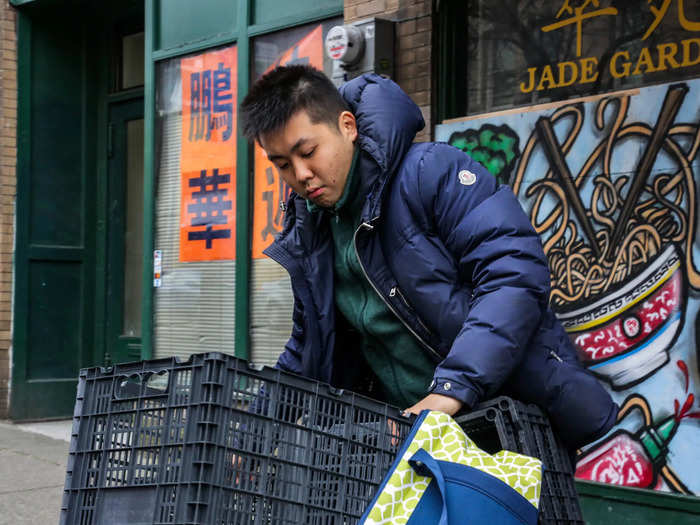 A little after 9:00 am, Chan arrived with a load of empty crates for packing delivery orders.