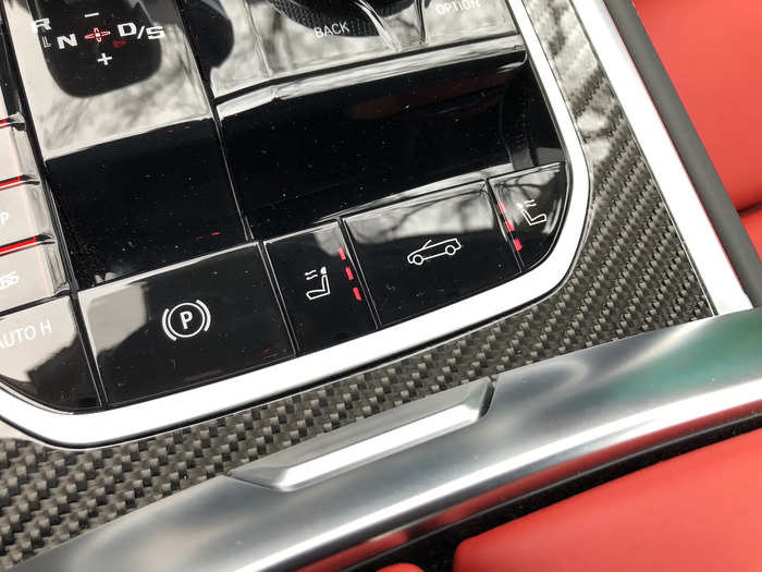 The headrest heaters are activated with a pair of buttons on either side of the convertible control.