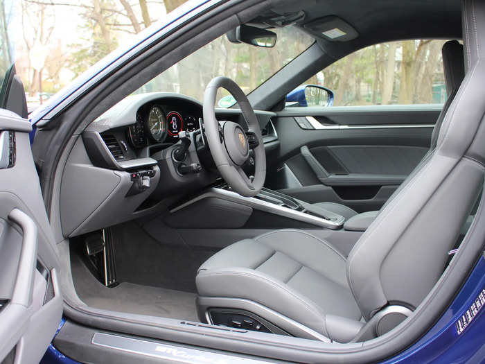 The slate-gray leather interior is rather minimalist for a car this expensive. Other tones are limited to brushed metal and piano-black surfaces, as well as some Alcantara.