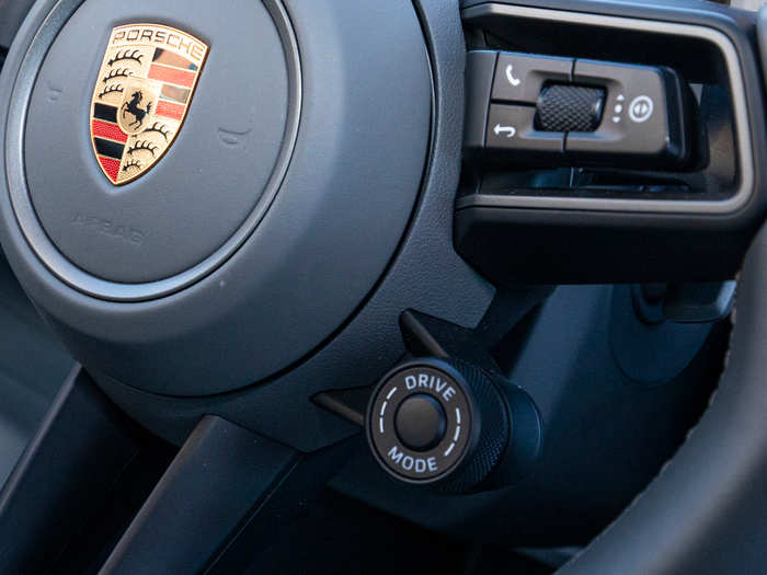 Drive modes are selected using the knob on the right side. Punch the center button and you get 20 seconds of screaming over-boosted turbo oomph. It does slightly warp time in practice.