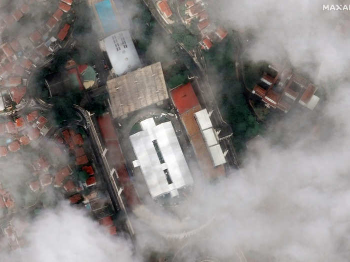 This image shows a massive field hospital built in the middle of Pacaembu Stadium in Sao Paulo, Brazil. The stadium is typically used for soccer matches and concerts, but is now the center of a 200-bed hospital to treat coronavirus patients.