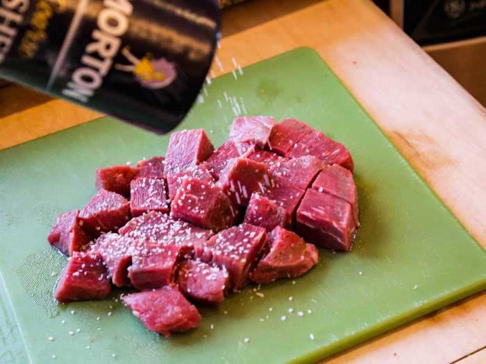 I cut the steak into thick cubes and doused it with salt and pepper.