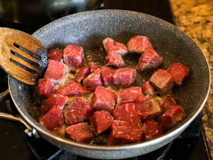 I heated up a pan, drizzled in some oil, and added my meat cubes.