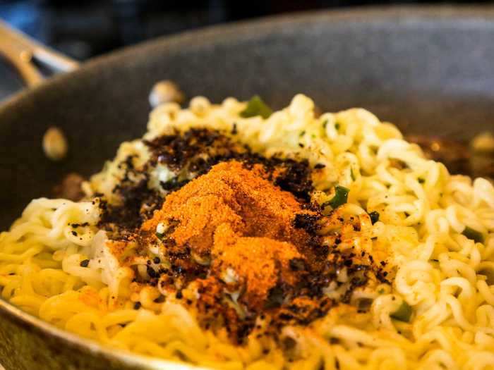 Then, I drained my noodles and transferred them to a pan with the beef. The recipe said to use all of the Chapagetti powder and 3/5 of the Neoguri powder. I accidentally added almost all of the Neoguri packet.