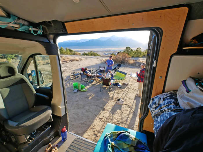 The camper boxes and cushions serve four purposes: storage, seating, sleeping, and kitchen use.