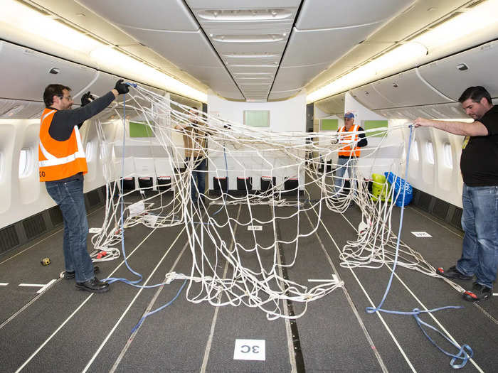 Inside the aircraft, economy and premium class seating will be removed to house the cargo, to be secured using nets.