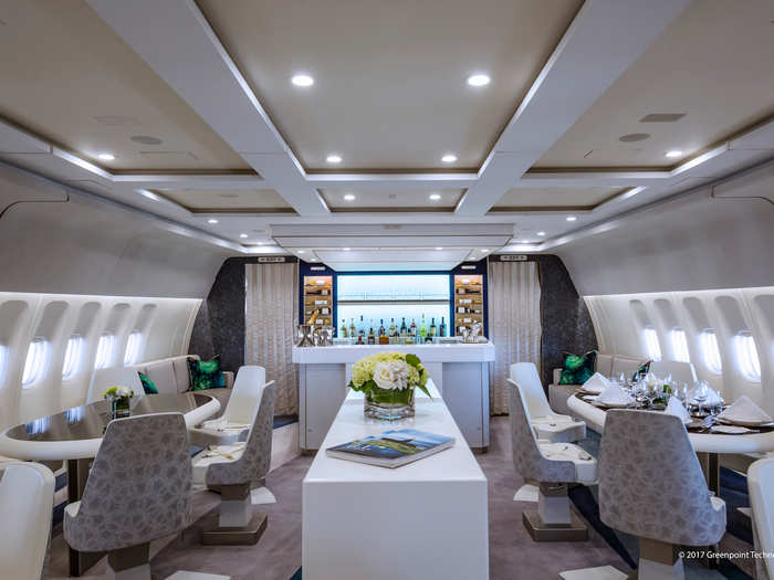 The communal space acts as a retreat from the main seating section the passengers call home during their airborne journey, aided with a fully-stocked bar and staffed with a fleet of butlers.