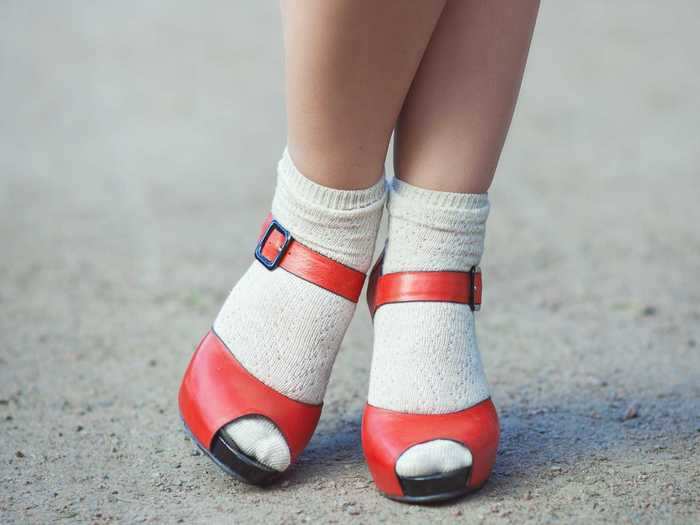 Socks with high heels is a bold look that can be fashionable.