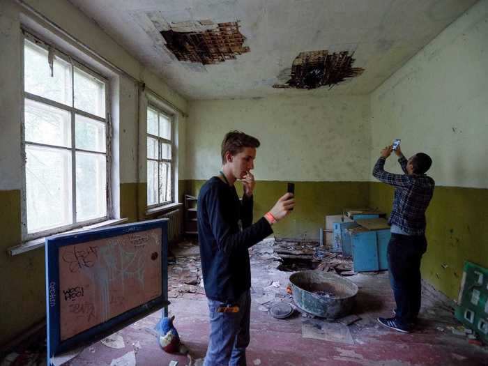 Today, people are still forbidden to live within 18 miles (30 km) of the power station but supervised tours still attract thousands of tourists every year. A tour guide warned of economic fallout from the forest fire.