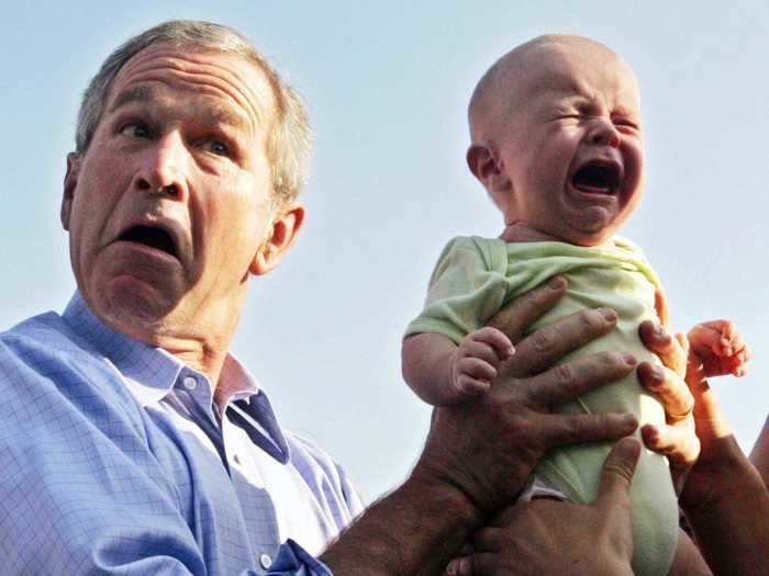 Former President George W. Bush looks about as unenthused as this baby.