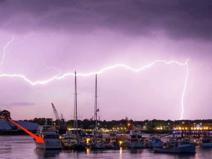 A photographer had perfect timing when he got this shot of lightning striking — and the name of the first boat proves that.