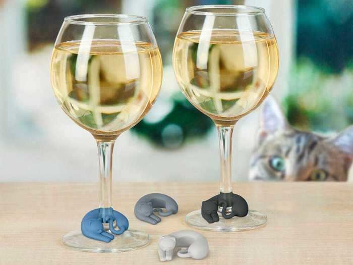 A collection of sleepy kitten wine charms