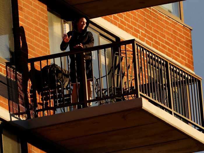 New Yorkers cheer and clap from their balconies every day at 7 p.m.