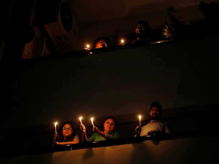 People light candles in New Delhi, India, to represent hope in the fight against the coronavirus.