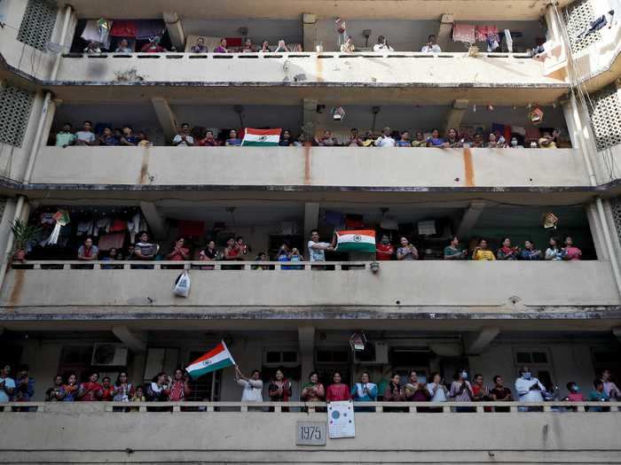 In Mumbai, India, people clap, cheer, and bang pans together for medical workers.