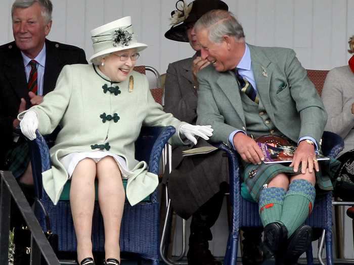 The Queen enjoys sharing a joke ...