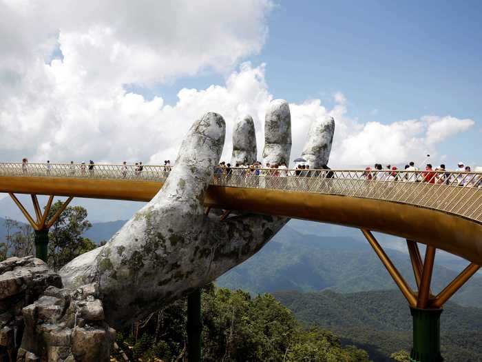 The Golden Bridge, a foot bridge near Da Nang, Vietnam, looks like it