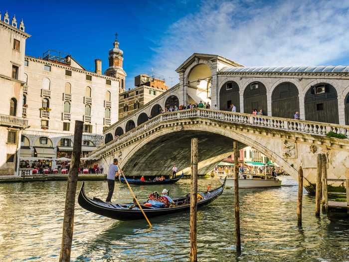 Small but unforgettable, the Rialto Bridge will help you cross one of Venice