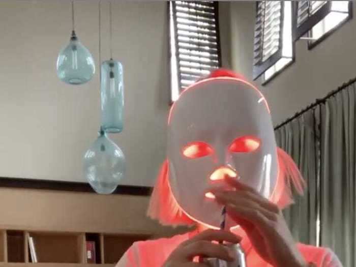 January Jones sipped a beer and wore an LED face mask in her living room.