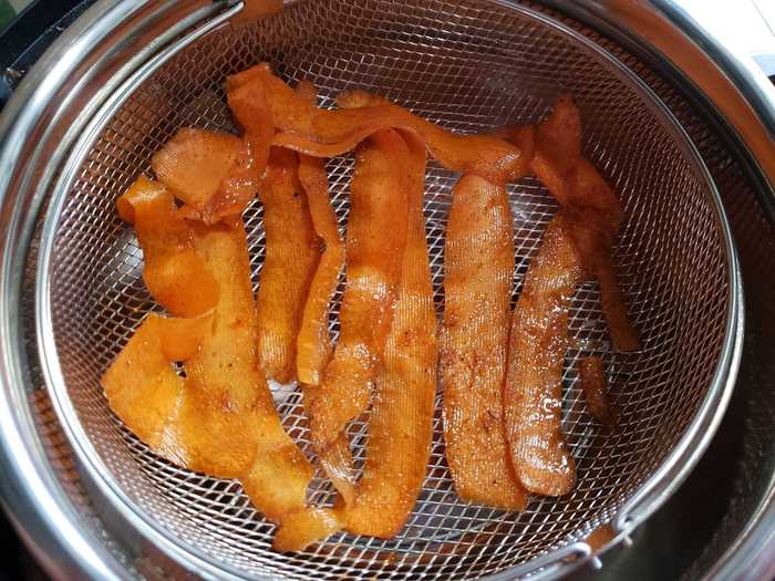 According to Brown, you should cook your carrot "bacon" at 380 degrees Fahrenheit for five minutes for crispy, crunchy results.