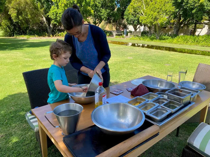 The hotel manager planned fun activities, like cooking and gardening, for the two families to stay occupied