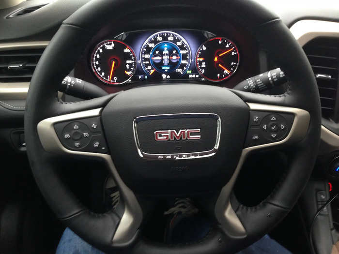 Purposeful leather, brushed metal, and a simple analog-style instrument panel present themselves to the driver. The overall impression is very masculine. And that makes sense, because GMC is aiming this vehicle, in this upscale trim level, at male buyers.