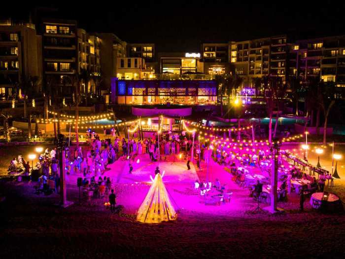 The couple turned the beach into a club for the night, setting up a dance floor in the sand.