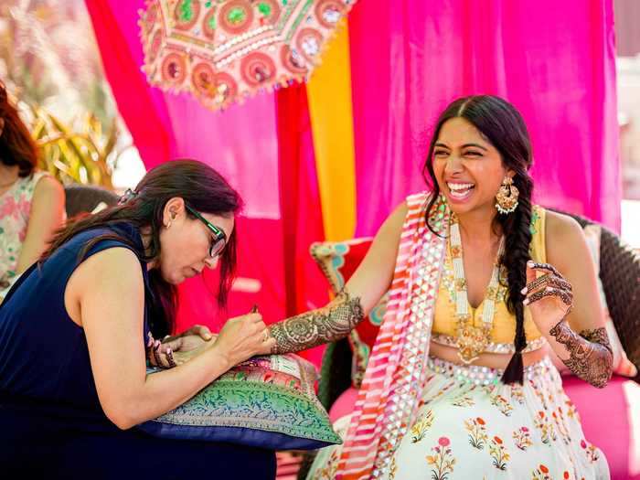 The next day started with a Mehndi party, where Reema was covered with henna.