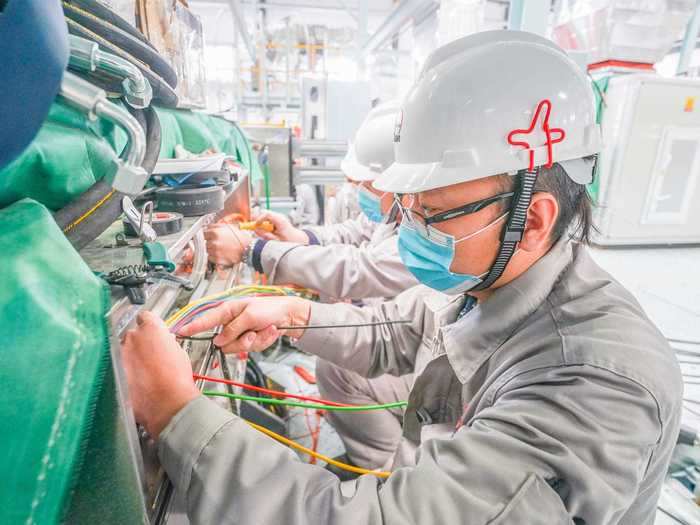 Leo Liu, a sales director at Haigong Machinery, a Chinese company that assembles machine parts for melt-blown lines, told NPR the machines take six months to make and another month to assemble.