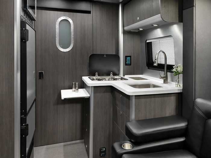Like many non-camper homes, the Atlas has a bathroom with a medicine cabinet vanity, faucet, shower, and porcelain toilet. The latter is a deviation from the typical pull-up or portable toilets found in many camper vans.