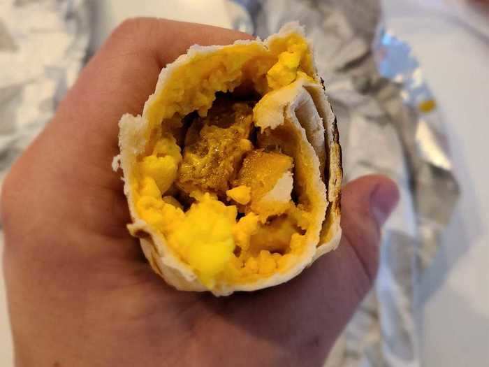 Cheesy toasted breakfast burrito with potato — $1.59