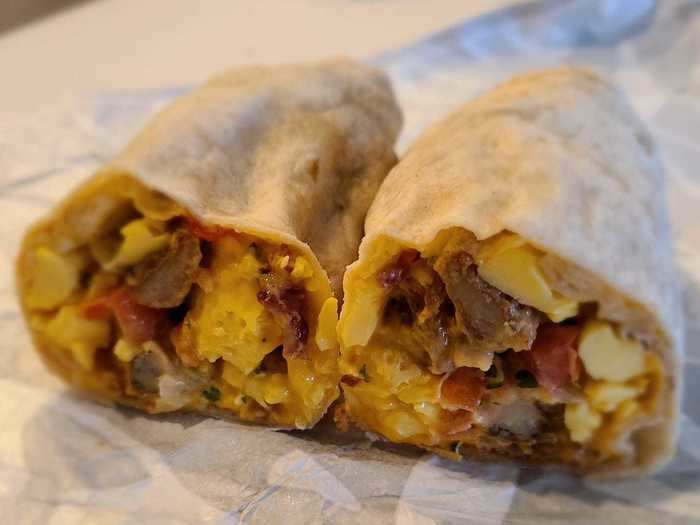 Grande toasted breakfast burrito with bacon — $2.79