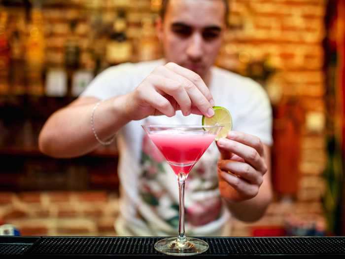 My husband finds it strange to tip bartenders and buy your own drinks at a bar.