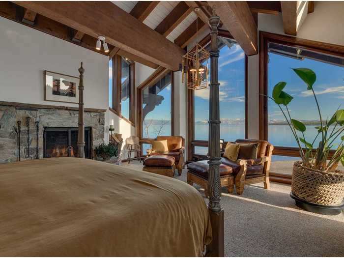 The master bedroom overlooks the lake, and has a fireplace.