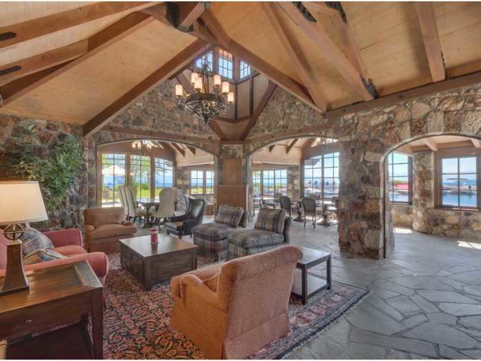 The property features some amazing vaulted ceilings and stone walls, while the breakfast nook has direct access to the lake