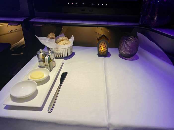 A few minutes after I finished my champagne, a flight attendant cleared my glass and the dish, and set up my table for lunch. I especially liked the electric "candle," a fun touch.