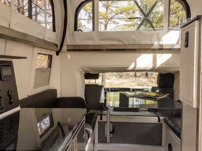 The lifted roof also has a 360-degree window, allowing passengers to enjoy the views of the outdoors while snug inside the insulated tiny home.