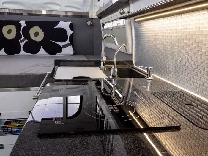 The EarthCruiser EXP has an interior kitchen with an optional exterior slide-out kitchen.