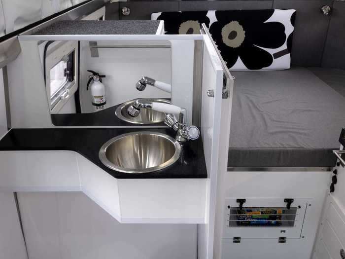 The sink and shower receive its water from the 44-gallon interior water tank and 30-gallon exterior water bladder.