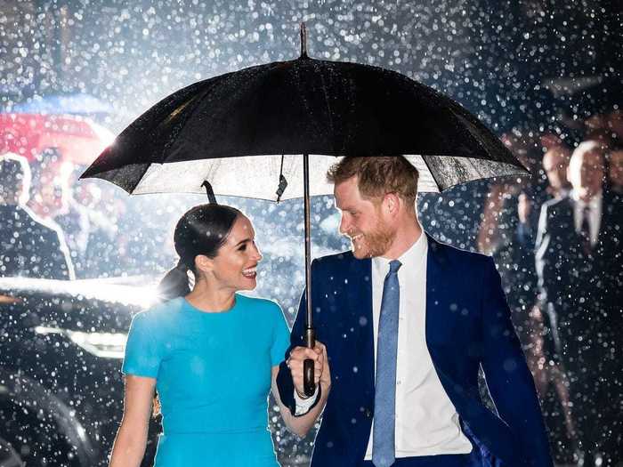 Photographer Samir Hussein captured this "one in a million" shot of Meghan Markle and Prince Harry smiling at each other under a shared umbrella.